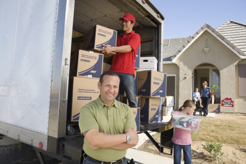 Mover carefully handling boxes during a removal job