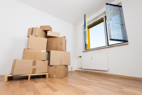 Packed boxes and moving equipment ready for removals