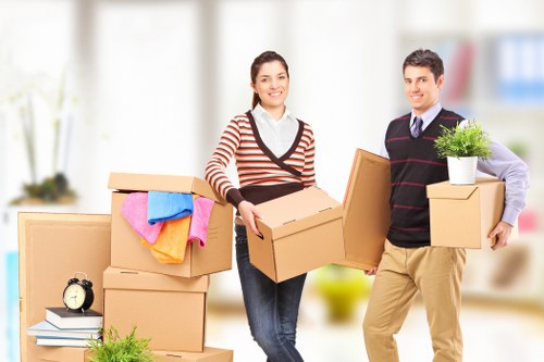 Loading furniture into a van for a small move in Epsom