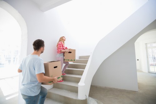 Packed moving boxes and furniture ready for transport