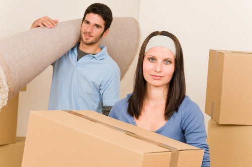 Local movers handling furniture in a Epsom home