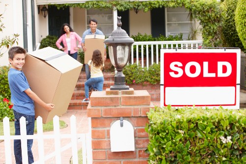 Professional movers loading furniture into a van in Epsom