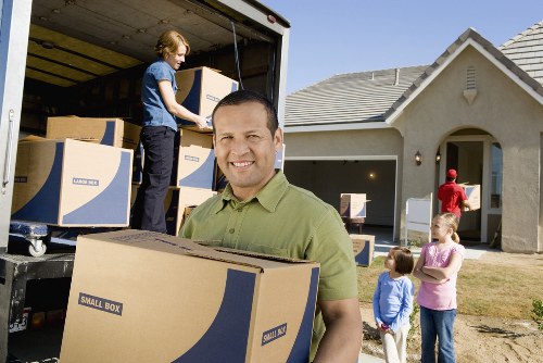 Local movers handling boxes and household items