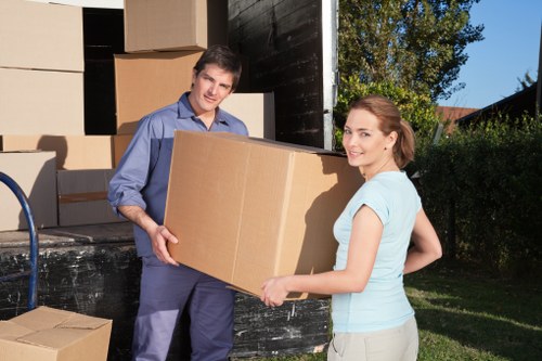 Prepared boxes and furniture ready for moving van transport